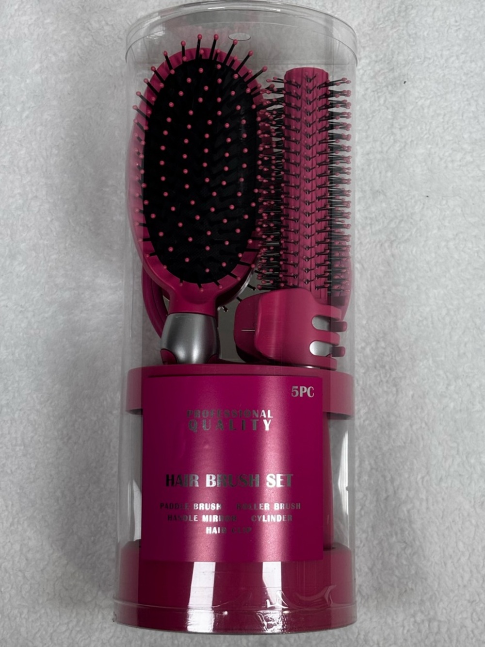 Pink 5‑pc hair brush set with paddle brush, round brush, comb, mirror, and clip